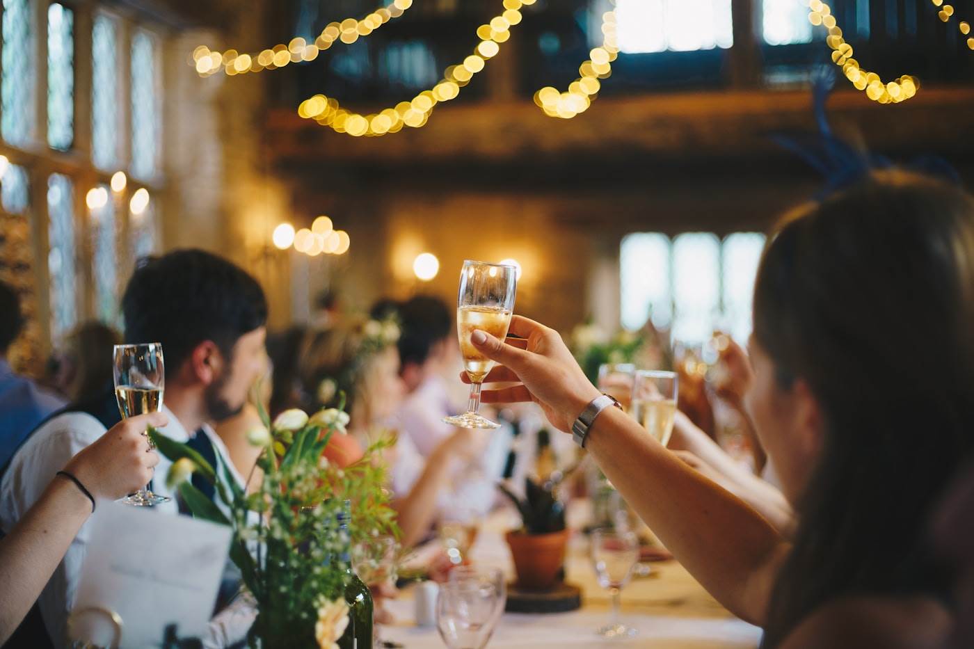 Warm-lit reception toast