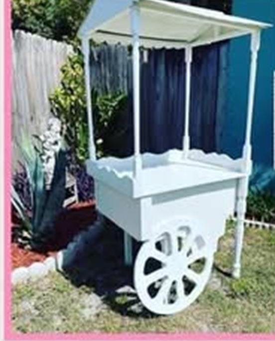 White candy cart at outdoor party